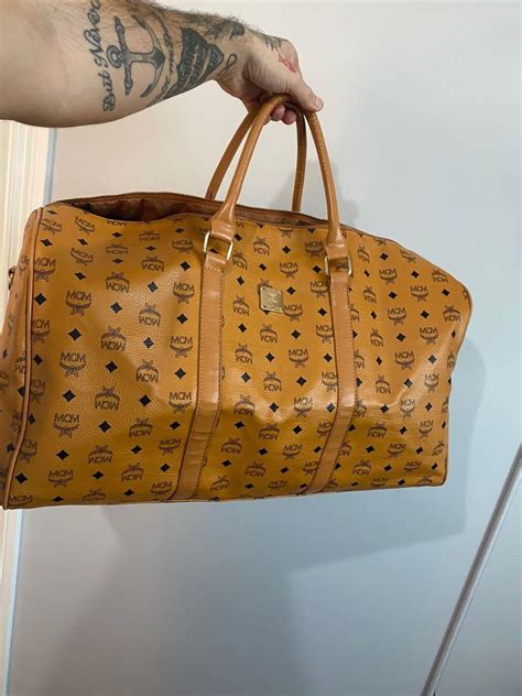 mcm duffle bag fake|mcm duffle bag large.